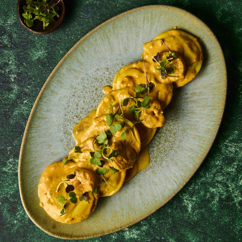 Grandi cappelli of free-range chicken and plum in chef’s sauce with king prawn